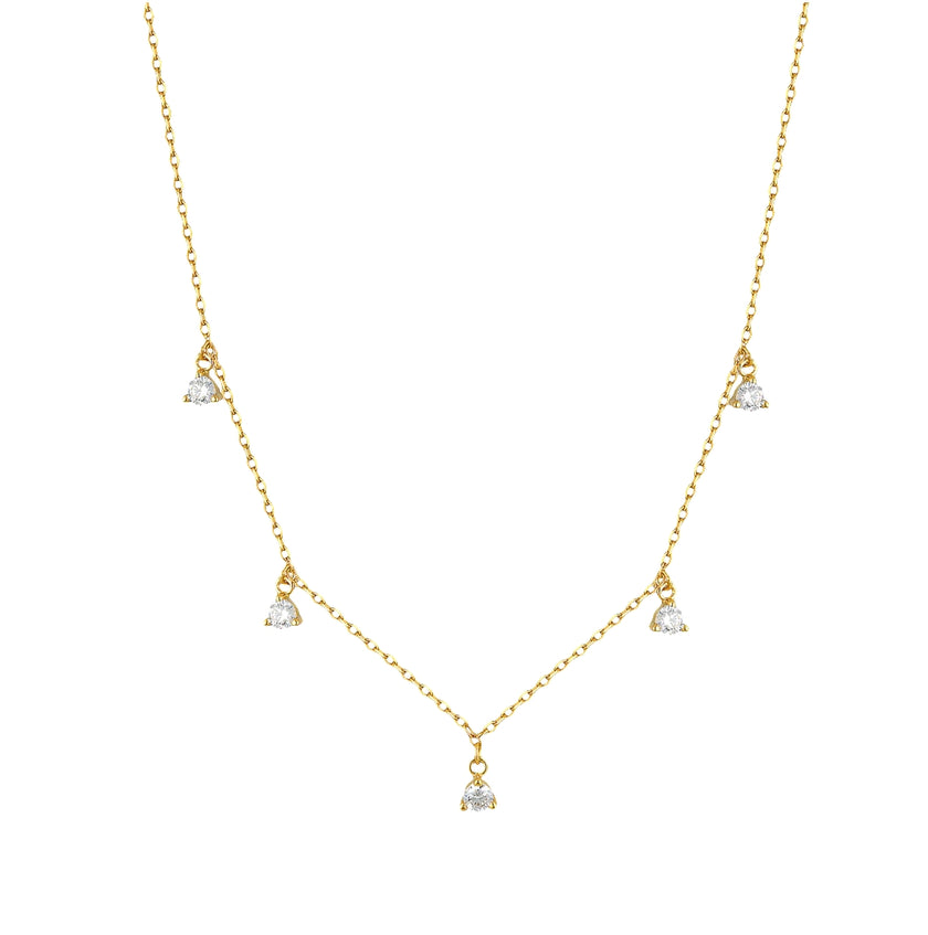 Gold necklace with small diamond pendants on a white background