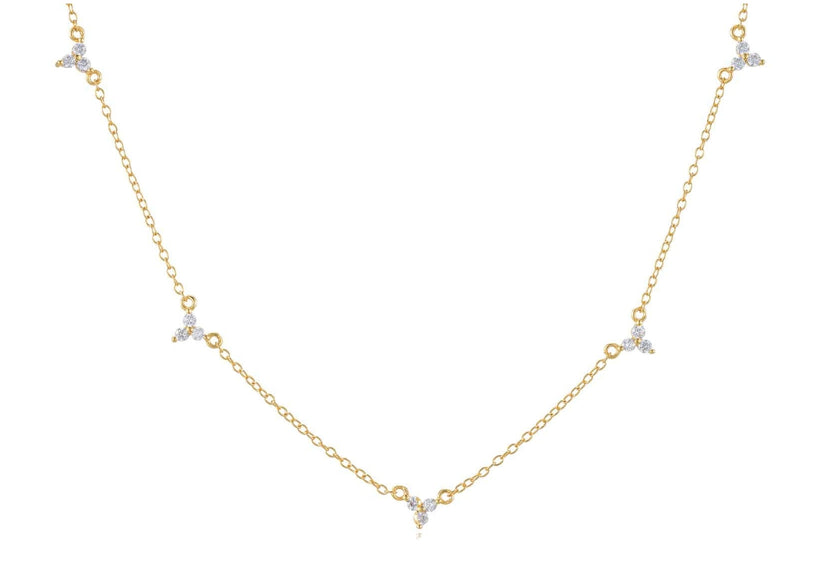 Gold necklace with small diamonds on a white background