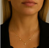 Gold Necklace with Multiple Star Pendants and Clear Gemstone Detailing by Teall