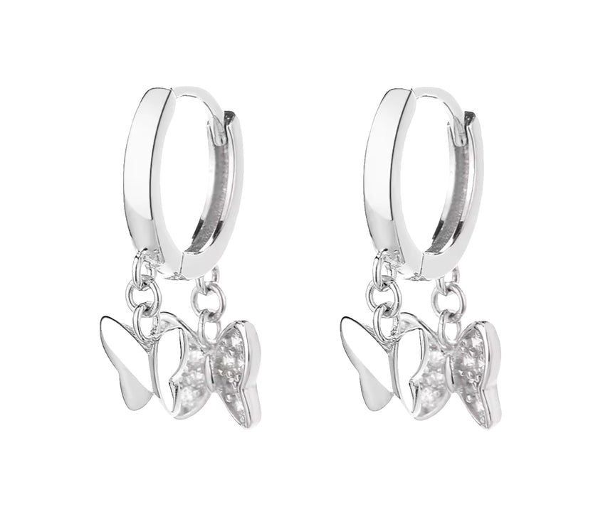 Silver hoop earrings with butterfly charms on a white background