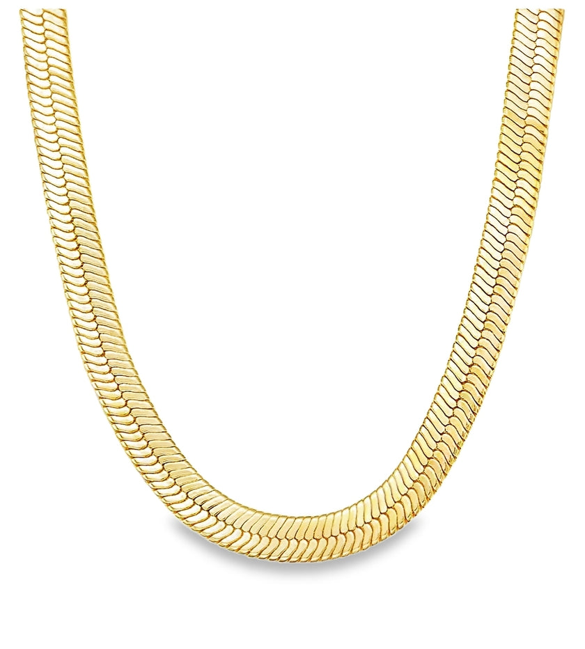 A gold layered necklace with a sleek, modern design featuring an intricate link pattern.