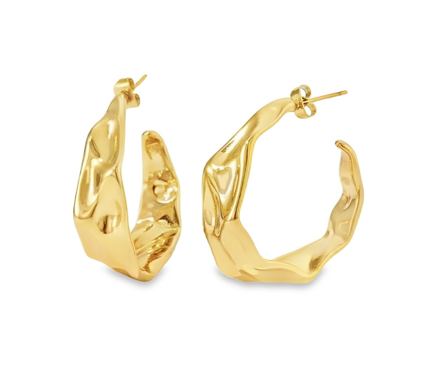 A pair of gold textured statement hoop stud earrings on a white background