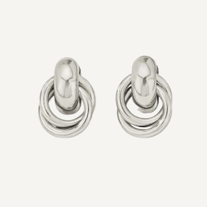 Pair of silver hoop earrings on a white background