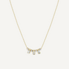 Gold necklace with small diamonds on a white background