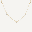 Gold necklace with small diamonds on a white background