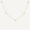 Gold necklace with small diamonds on a white background