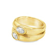 Teall Jewellery gold statement ring with two stacked bands and offset oval white gemstones, bold and modern design on a white background
