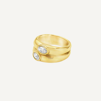 Teall Jewellery gold statement ring with two stacked bands and offset oval white gemstones, bold and modern design on a white background