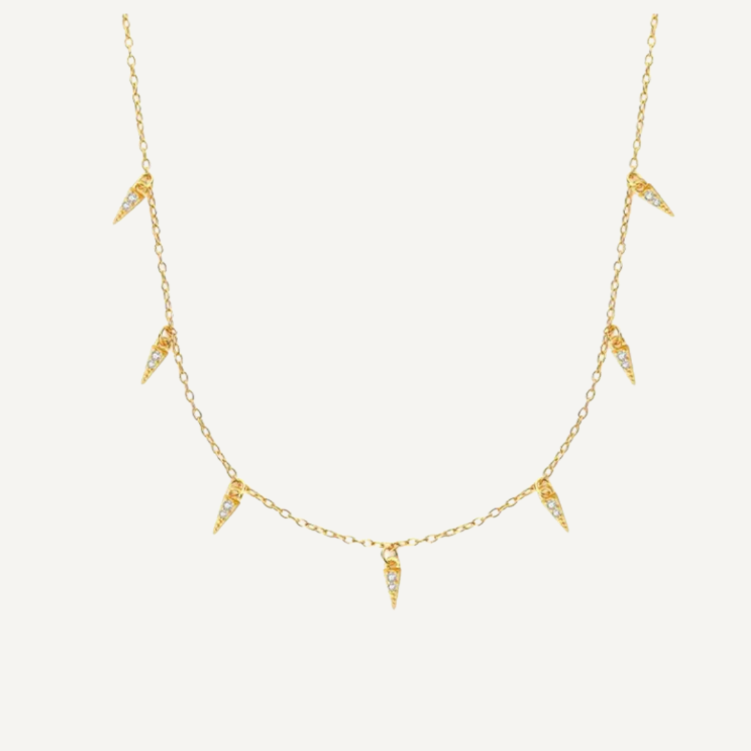Teall Jewellery gold necklace featuring small clear stone triangle pendants evenly spaced along a fine chain, minimalist and elegant design on a white background