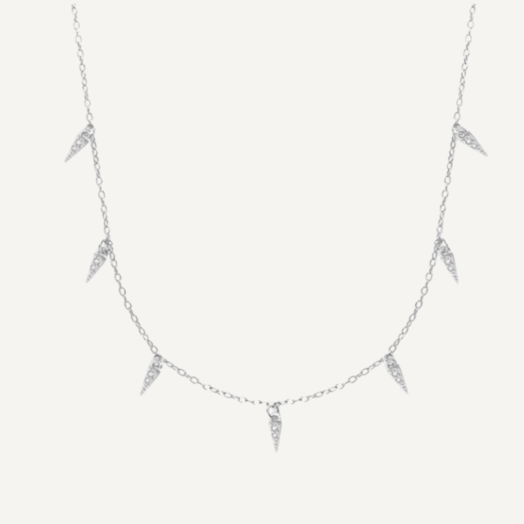 Teall Jewellery gold necklace featuring small clear stone triangle pendants evenly spaced along a fine chain, minimalist and elegant design on a white background