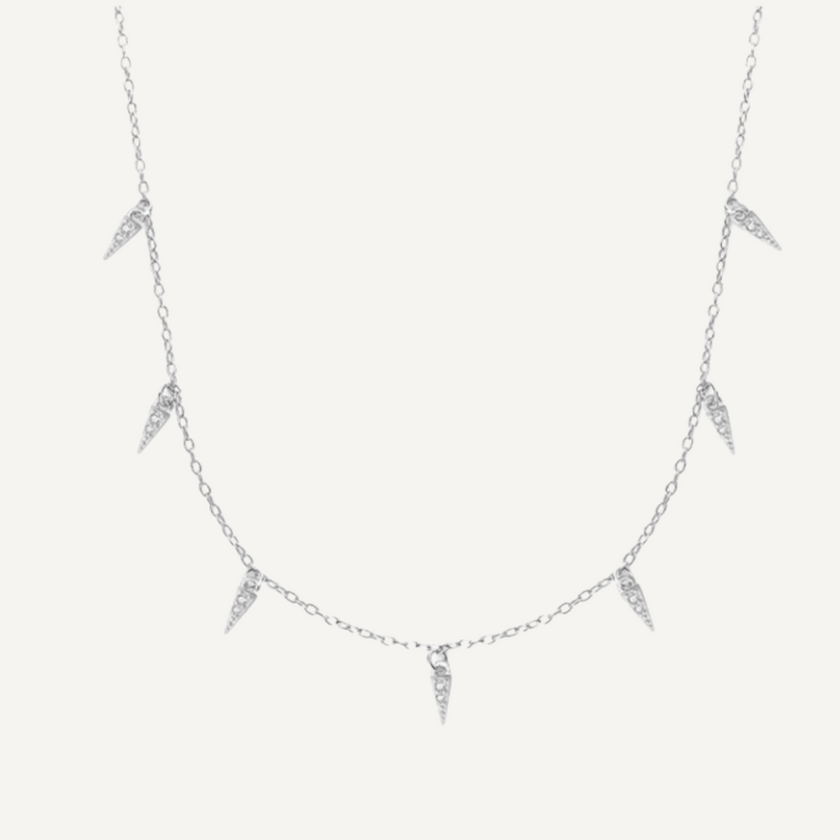 Teall Jewellery gold necklace featuring small clear stone triangle pendants evenly spaced along a fine chain, minimalist and elegant design on a white background