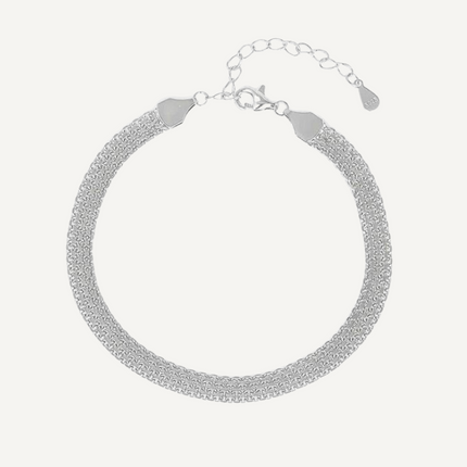 Silver bracelet on a light gray background