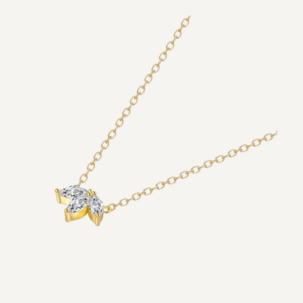 Claire Necklace by Teall 18k Gold Plated Clover Shaped Pendant on Gray Background 