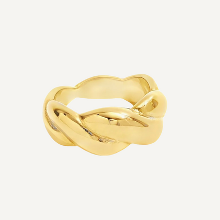 Gold ring with a braided design on a light gray background