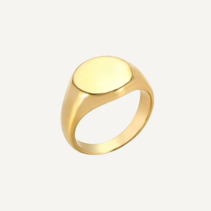 Gold ring on a light gray background