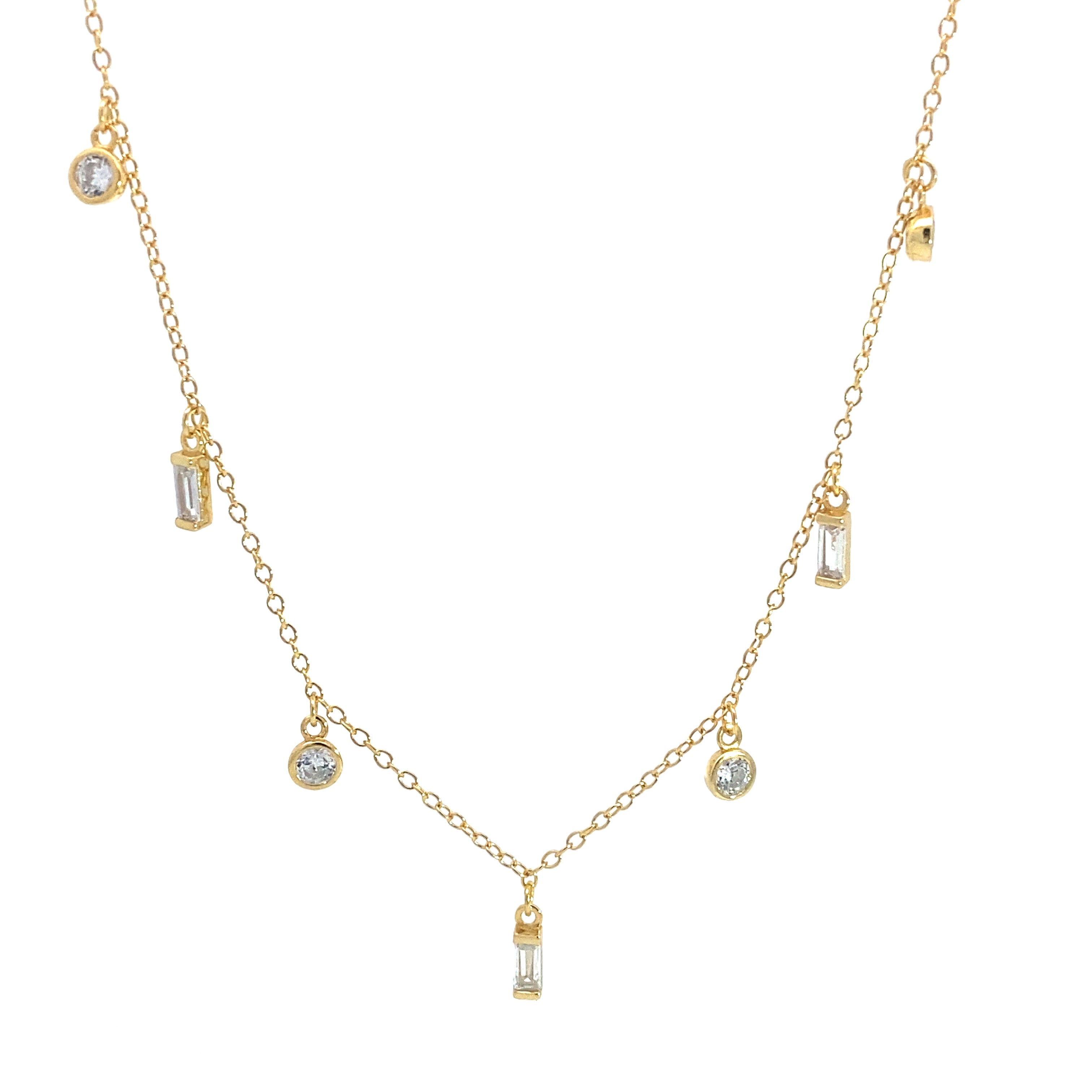 Gold necklace with alternating round and baguette clear gemstone drop pendants on fine chain, white background.