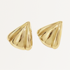 Gold cone-shaped earrings on a light beige background