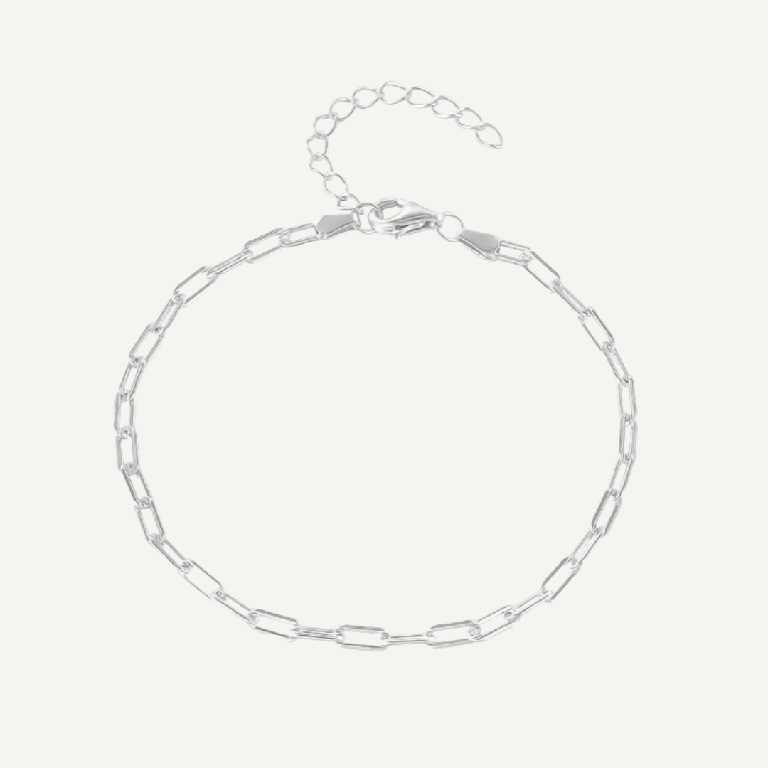 Silver chain bracelet on a light gray background