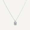 Silver necklace with a rectangular pendant on a light gray background