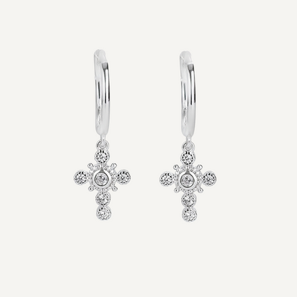 The Mauve Earrings by Teall feature a delicate cross drop design with clear gemstone detailing, perfect for everyday wear. 