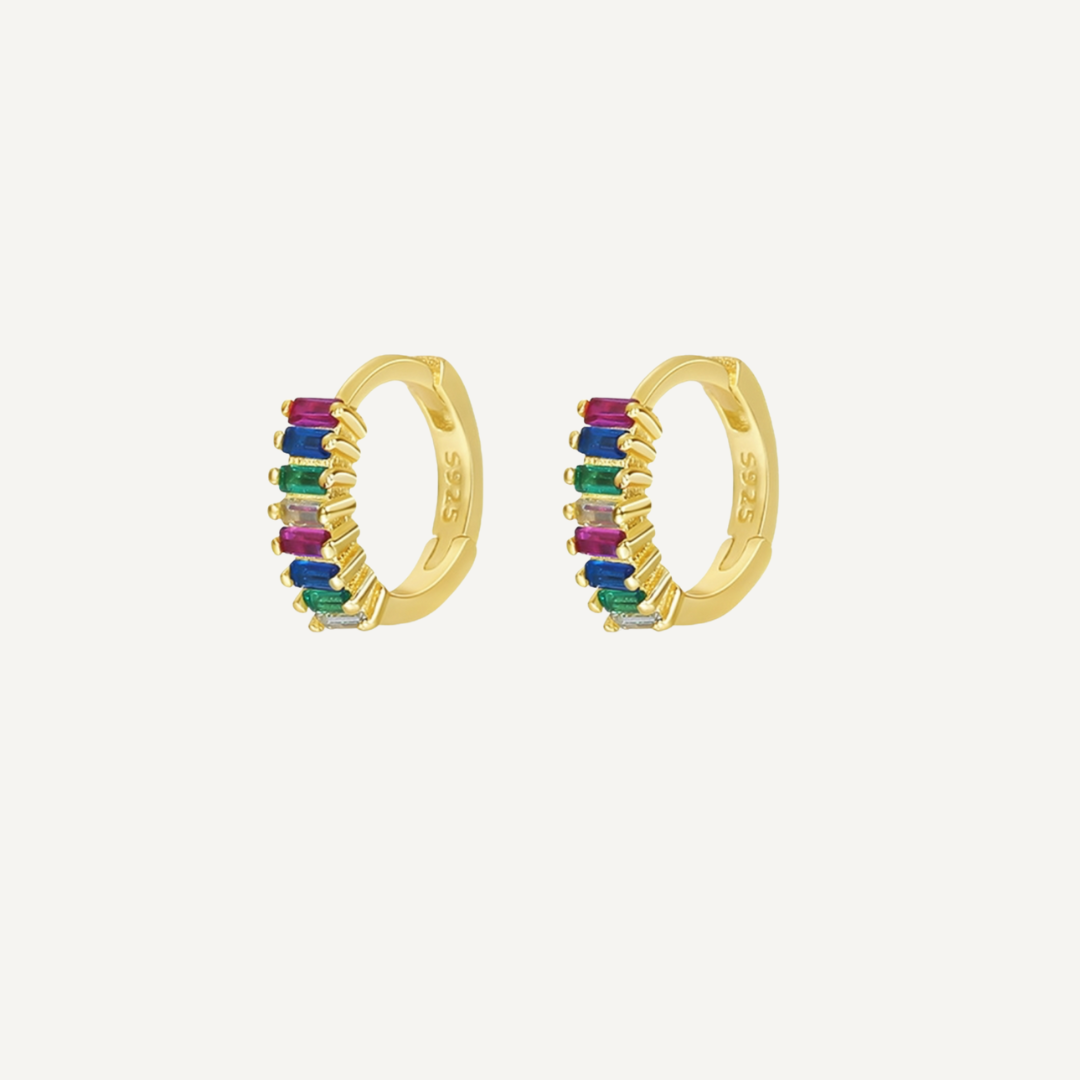 Gold hoop earrings with colorful stones on a white background