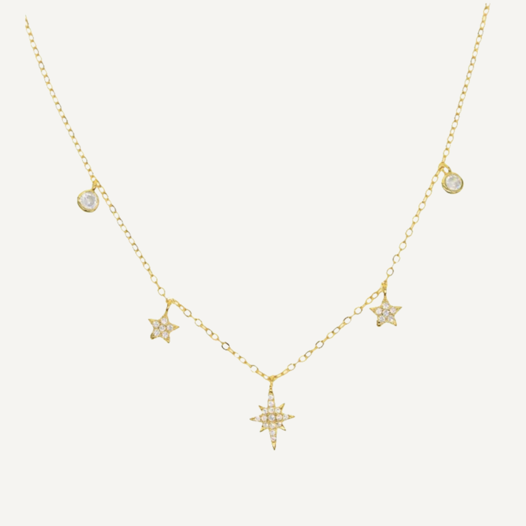 Gold necklace with star-shaped pendants on a white background