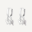 Silver hoop earrings with butterfly charms on a white background