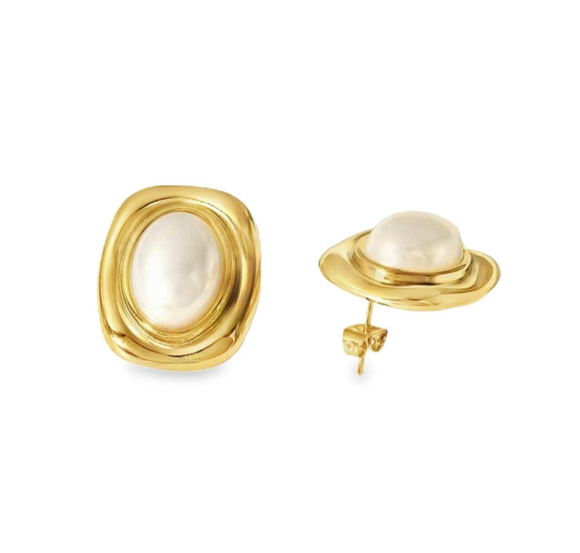 A pair of gold-colored statement stud earrings featuring a rectangular silhouette with a luminous pearl centerpiece, framed in polished stainless steel with 18k gold plating.