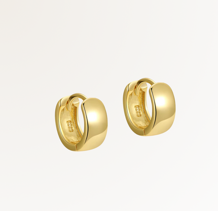 Gold hoop earrings on a light gray background, Siena Huggies by Teall Jewellery Perth Australia 